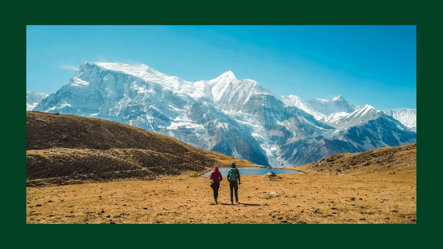 Colorful Buddhist prayer flags flutter with Mount Everest in the background, setting the serene and festive atmosphere of Nepal for holiday gifts.