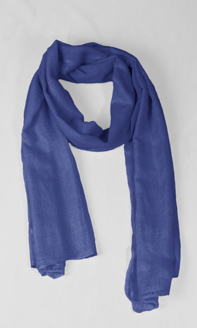 A detailed shot of the premium handwoven 100% pure Aniline Blue cashmere shawl in a season less loop shape.