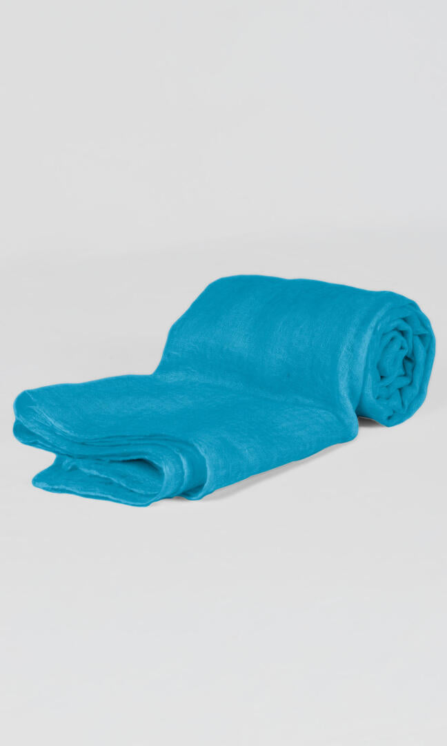 Close-up of the premium handwoven 100% pure Celeste Blue cashmere shawl - flat rolled view to convey its easy-to-pack feature.