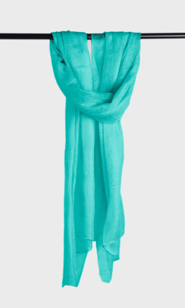 100% Pure Tiffany Blue Cashmere Shawl Handmade, exceptionally soft, lightweight & easy to use as a shawl, wrap, or scarf every day is protective & stylish. A hanging view.