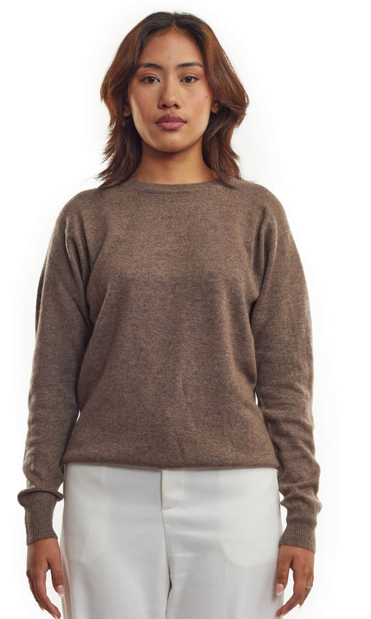 A woman in Rich Coffee Cashmere Cardigan, an essential addition for the season, in pullover-style with a roundneck in relaxed fit; a full front view.