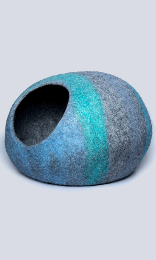 Abstract Oceanic Cat cave house with oval-shaped bed features a gray base with a sky blue & tiffany blue abstract paint-like design, a left side view.