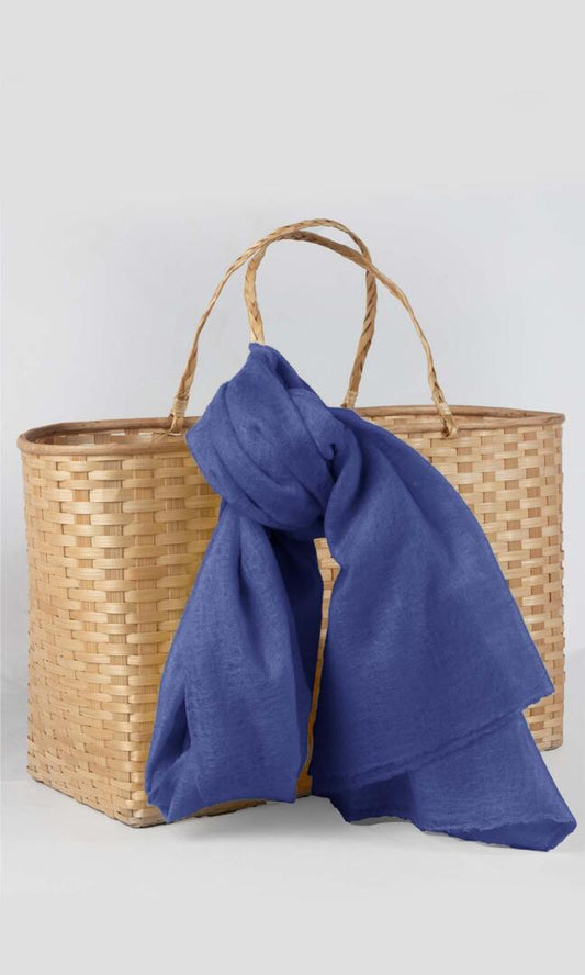 Detailed shot of the premium handwoven 100% pure Aniline Blue cashmere shawl - tied to the handle of the traditional bamboo gift basket.