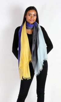 A beautiful model drapes the stunning and eye-catching super lightweight four-color cashmere romance shawl around her neck as a long scarf.