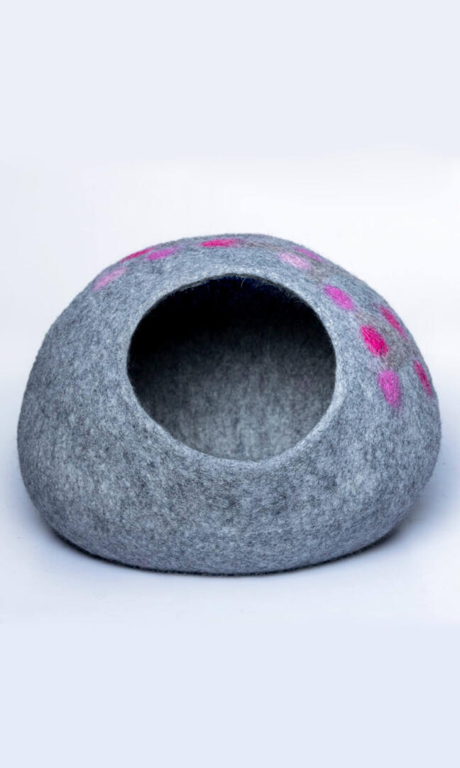 Adorable paw print design cat home, made with premium felted wool, a front view of the entrance.