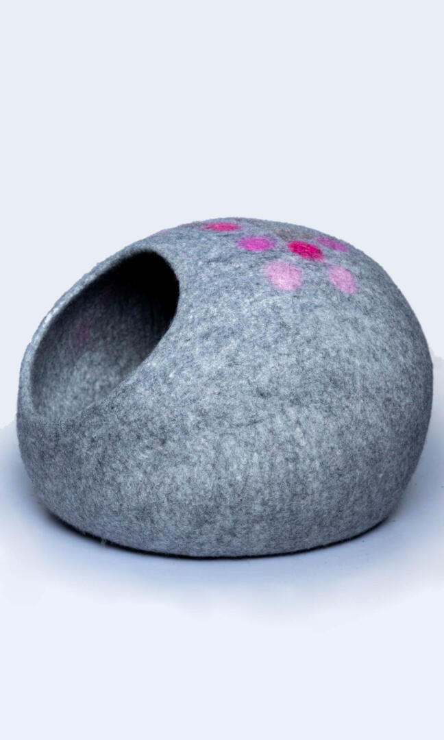 Adorable paw print design cat home, made with premium felted wool, a left side view.