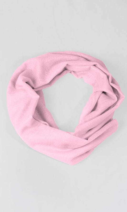 A detailed shot of the premium handwoven 100% pure Baby Pink cashmere shawl in an infinity loop shape.