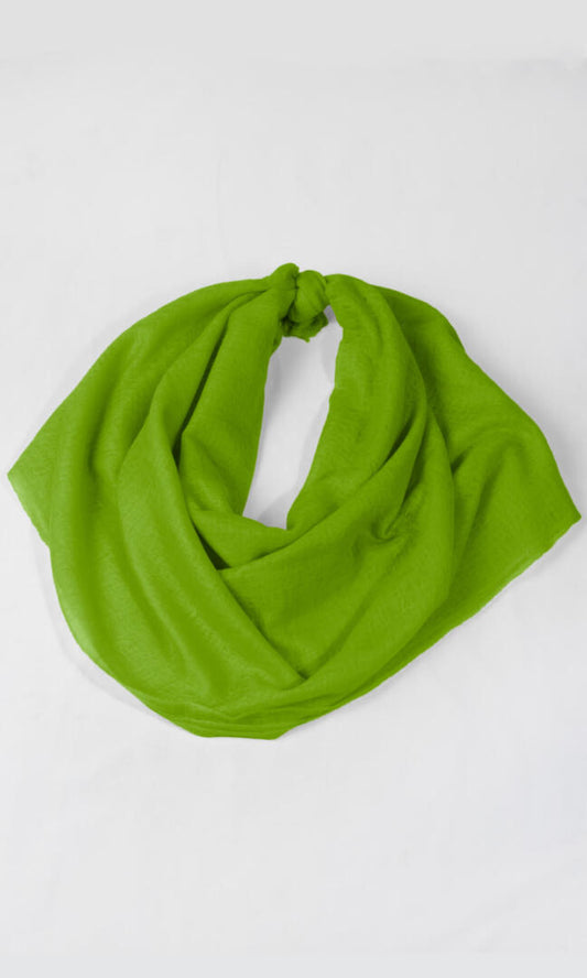 A detailed shot of the premium handwoven 100% pure Chartreuse Green cashmere shawl in a knot loop shape.