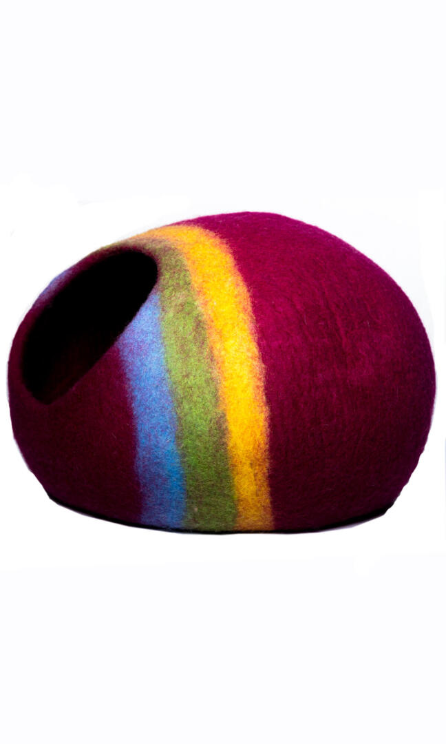 The rainbow retreat cat cave house in dark red premium felted wool with colorful stripes, a side view.