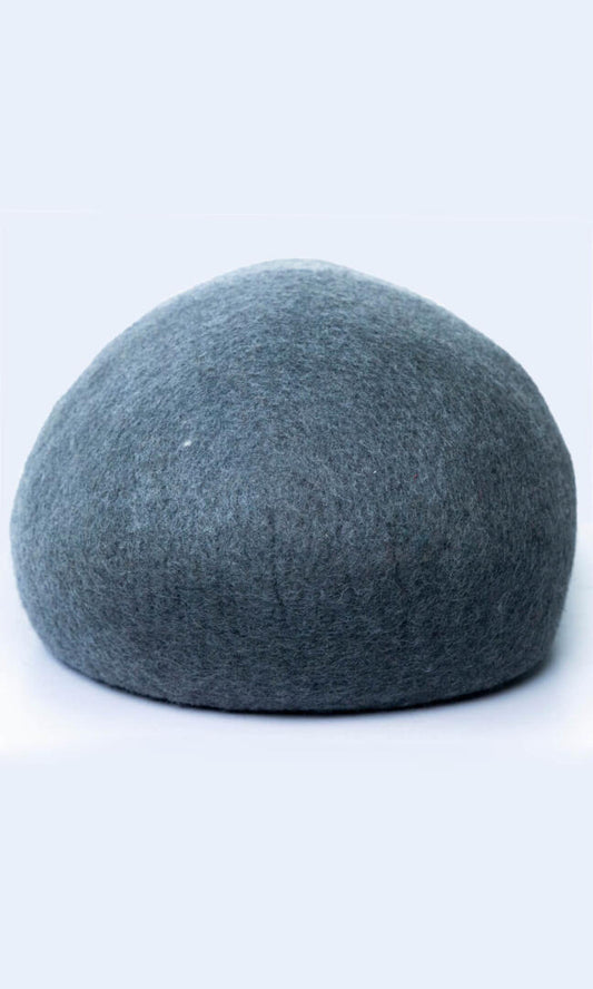 Image of the two-tone handmade felted wool cat cave, providing a warm and comfortable hideaway for cats with a comfortable entrance; a full back view.