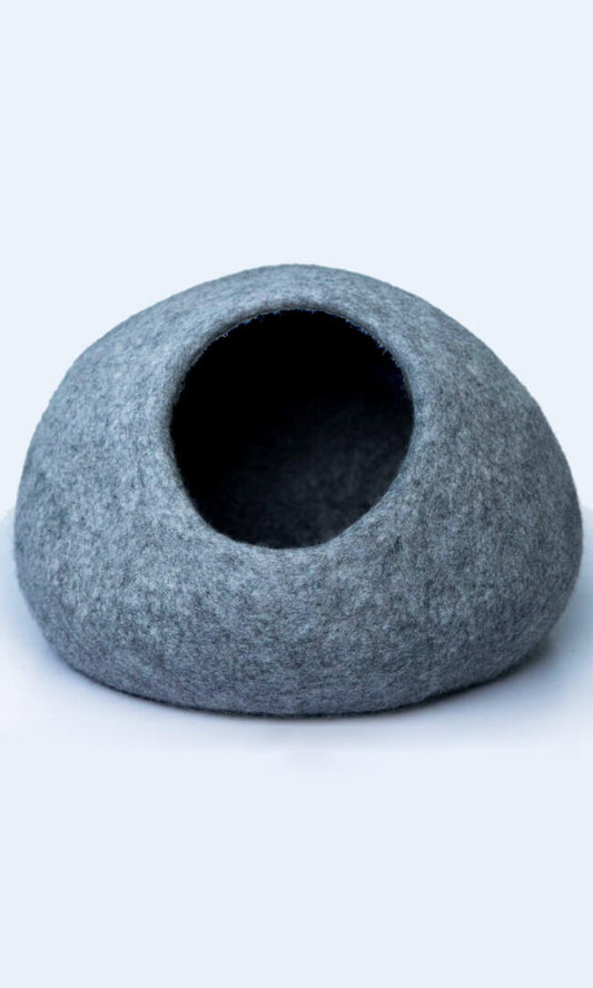 Image of the two-tone handmade felted wool cat cave, providing a warm and comfortable hideaway for cats with a comfortable entrance; a full front view.