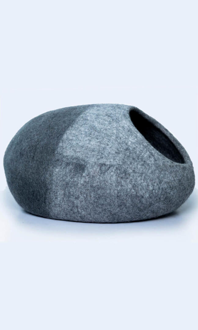 Image of the two-tone handmade felted wool cat cave, providing a warm and comfortable hideaway for cats with a comfortable entrance; a full right view.