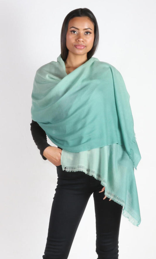 Graceful 6ft tall female model showcasing our Sea Green Ombre Cashmere Shawl as a luxurious wedding accessory.
